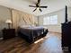 Main bedroom with king bed, dresser, and large window at 813 S Zion St, Landis, NC 28088