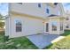 Tan house exterior showcasing a back patio and access door at 8436 Dawson Ln, Locust, NC 28097