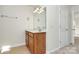 Clean bathroom features a vanity with wood cabinets and a large mirror at 8436 Dawson Ln, Locust, NC 28097