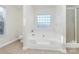 Relaxing bathroom with a large soaking tub and a separate shower at 8436 Dawson Ln, Locust, NC 28097