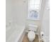 Clean bathroom with a tub shower combo and tile flooring at 8436 Dawson Ln, Locust, NC 28097