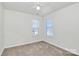 Spacious bedroom with neutral walls, carpet flooring, and ceiling fan at 8436 Dawson Ln, Locust, NC 28097