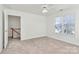 Upstairs bedroom with carpet, ceiling fan, and window at 8436 Dawson Ln, Locust, NC 28097