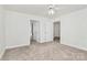 Bright bedroom with carpet, ceiling fan and access to bath at 8436 Dawson Ln, Locust, NC 28097