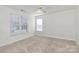 Upstairs bedroom with carpet, ceiling fan and window at 8436 Dawson Ln, Locust, NC 28097