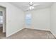 Bright bedroom with ceiling fan and carpet at 8436 Dawson Ln, Locust, NC 28097