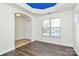 Entryway with blue coffered ceiling, stained glass, hardwood floors at 8436 Dawson Ln, Locust, NC 28097