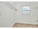 Laundry area with window and shelving at 8436 Dawson Ln, Locust, NC 28097