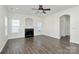 Bright living room features hardwood floors, fireplace, and neutral walls at 8436 Dawson Ln, Locust, NC 28097