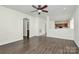 Open living room with hardwood floors and kitchen views at 8436 Dawson Ln, Locust, NC 28097