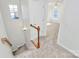 Upstairs hall with carpet, stairs, and bedroom access at 8436 Dawson Ln, Locust, NC 28097