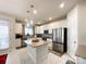 Modern kitchen with stainless steel appliances and an island at 9027 Daring Ct, Charlotte, NC 28215