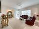 Spacious living room with two leather sofas and a large window at 9027 Daring Ct, Charlotte, NC 28215