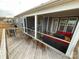 Spacious deck with a screened porch and outdoor furniture at 9027 Daring Ct, Charlotte, NC 28215