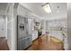 Modern kitchen with stainless steel appliances and hardwood floors at 9241 Legrand Dr, Terrell, NC 28682