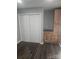 Spacious bedroom closet with built-in shelving and cabinets at 104 Rice St, Kannapolis, NC 28081