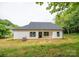 This home features new construction, a black roof and white siding with ample backyard space at 117 Chavis Ln, Lincolnton, NC 28092