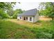 A spacious backyard with healthy green grass and recently constructed home at 117 Chavis Ln, Lincolnton, NC 28092