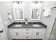 The spacious bathroom with a dual vanity and granite countertops offers plenty of space and style at 117 Chavis Ln, Lincolnton, NC 28092