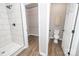Bathroom featuring an enclosed toilet, a walk-in shower, and a wire shelving closet at 117 Chavis Ln, Lincolnton, NC 28092