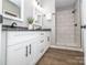 Bathroom featuring a dual vanity, black hardware, and a walk-in shower with neutral tiling at 117 Chavis Ln, Lincolnton, NC 28092