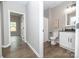 Bathroom featuring shower and tub combo, vanity with sink, toilet, and decorative mirror at 117 Chavis Ln, Lincolnton, NC 28092
