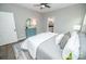 Bedroom featuring wood-look floors, neutral paint, and ensuite bathroom access for convenient living at 117 Chavis Ln, Lincolnton, NC 28092
