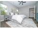 The bedroom features wood-look floors, a ceiling fan, natural light, and neutral paint for a calming ambiance at 117 Chavis Ln, Lincolnton, NC 28092