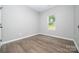 Cozy bedroom with neutral walls, hardwood floors, and a single window at 117 Chavis Ln, Lincolnton, NC 28092