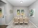 Cozy dining area featuring a wooden table with seating for six and natural light at 117 Chavis Ln, Lincolnton, NC 28092