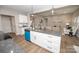 Modern kitchen island with granite countertop, seating, and a view of the open living space at 117 Chavis Ln, Lincolnton, NC 28092