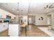 Bright kitchen with white cabinets, granite countertops, stainless steel appliances and pendant lighting at 117 Chavis Ln, Lincolnton, NC 28092