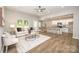 Inviting living room with ceiling fan, hardwood floors, and an open layout to the kitchen at 117 Chavis Ln, Lincolnton, NC 28092