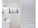 Bathroom featuring a vanity with modern black faucet and subway tiles at 2504 S Cannon Blvd, Kannapolis, NC 28083