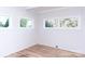 Bright bedroom featuring wood floors and multiple windows providing natural light at 2504 S Cannon Blvd, Kannapolis, NC 28083