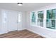 Open entryway featuring wood floor, bright white door with sidelight window, and ample natural light at 2504 S Cannon Blvd, Kannapolis, NC 28083