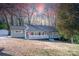 Charming home featuring a covered front porch with white railings and a well-maintained lawn at 2504 S Cannon Blvd, Kannapolis, NC 28083
