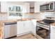 Modern kitchen with stainless steel appliances, butcher block countertops, and subway tile backsplash at 2504 S Cannon Blvd, Kannapolis, NC 28083