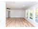 Bright, spacious living room with beautiful vinyl flooring and large windows with a backyard view at 2504 S Cannon Blvd, Kannapolis, NC 28083
