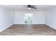 Open living room space featuring a ceiling fan and sliding glass door at 2504 S Cannon Blvd, Kannapolis, NC 28083