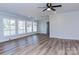 Living room featuring paneled walls, crown molding, and hardwood floors at 2504 S Cannon Blvd, Kannapolis, NC 28083