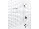 This shower features new subway tile and black hardware at 2504 S Cannon Blvd, Kannapolis, NC 28083