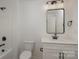 Clean bathroom with white vanity, black fixtures, and a large mirror at 3012 Sadler Woods Ln, Charlotte, NC 28214