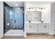 Bathroom with double vanity, walk in shower, and modern lighting at 3025 Swallowtail Ln, Kannapolis, NC 28083