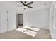 Spacious bedroom with ceiling fan and large window at 3025 Swallowtail Ln, Kannapolis, NC 28083