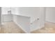 Upstairs hallway with neutral carpeting and a light-filled window at 3025 Swallowtail Ln, Kannapolis, NC 28083