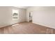 Spacious bedroom featuring a large window and neutral decor at 3266 Maple Ridge Dr, Gastonia, NC 28052