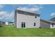 Two story house back elevation with sliding glass doors and backyard view at 3266 Maple Ridge Dr, Gastonia, NC 28052