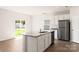 Modern kitchen with island, granite countertops, and stainless steel appliances at 3266 Maple Ridge Dr, Gastonia, NC 28052