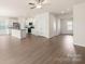 Open concept kitchen with island, stainless steel appliances, and light wood floors at 3266 Maple Ridge Dr, Gastonia, NC 28052
